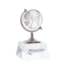 Trophy Award - Crystal Globe held by a silver c-clamp mounted on clear crystal base